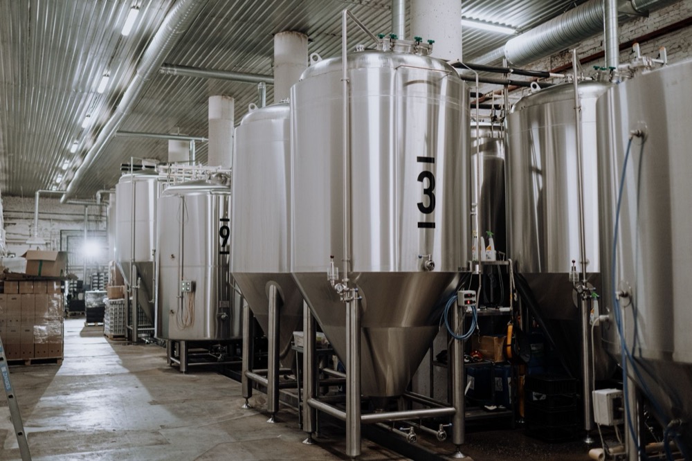 Stainless process tanks in a beverage plant.