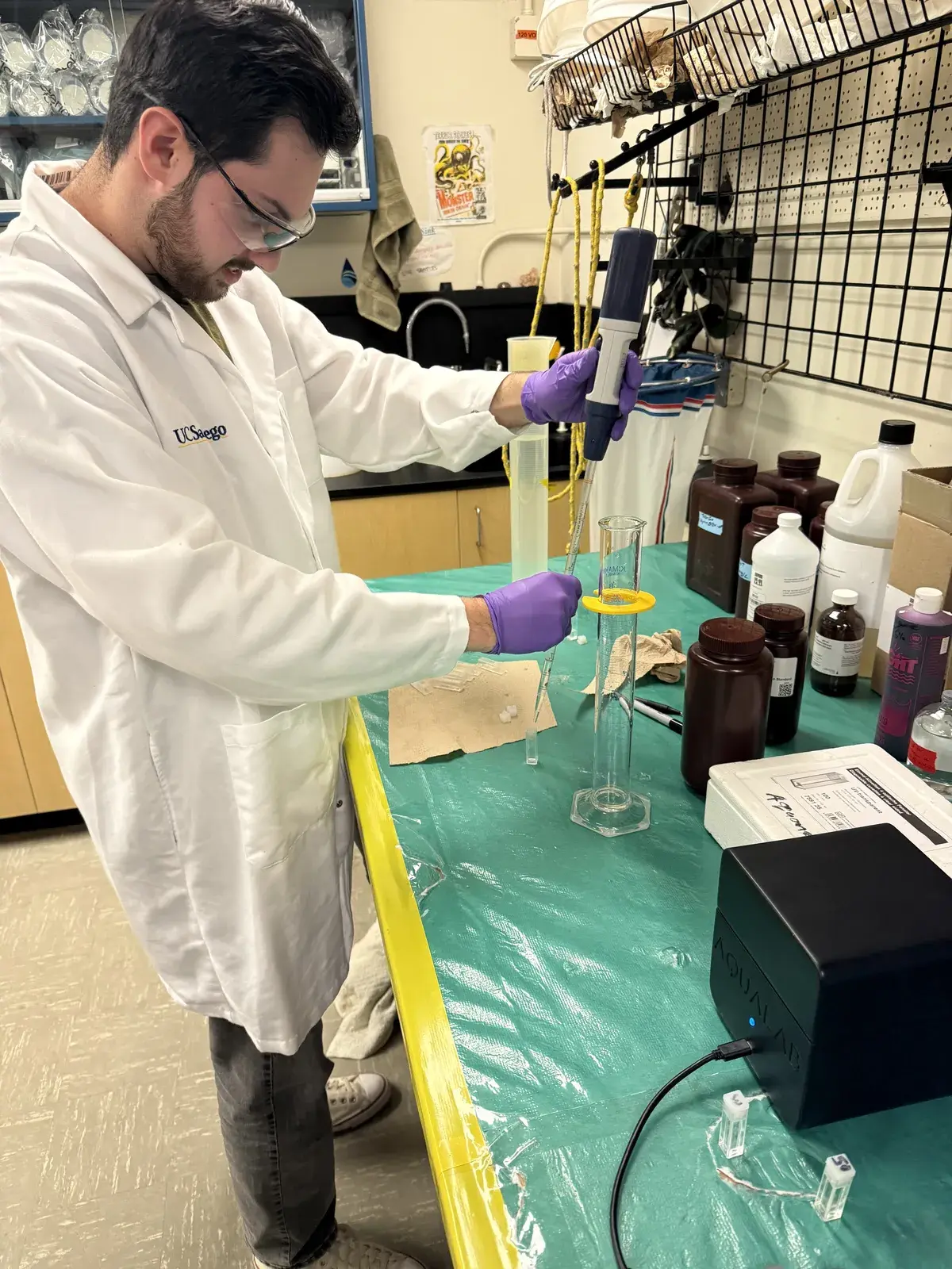 Researcher performing calibration work at the lab bench